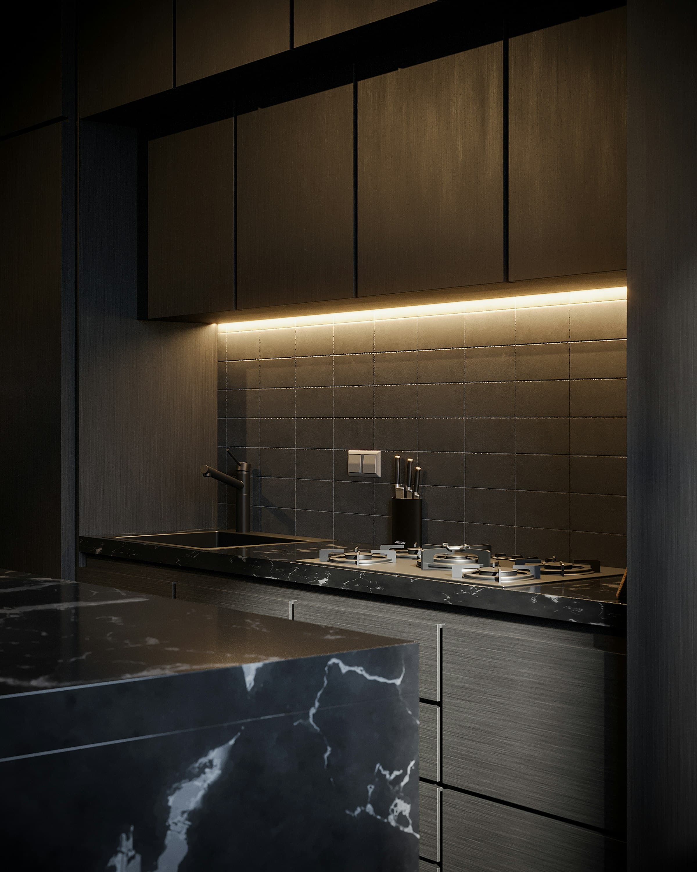 A dark, moody kitchen interior at dusk with warm lighting